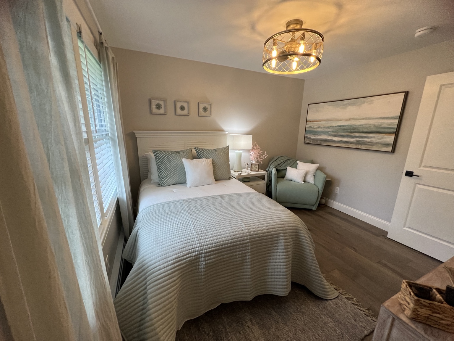 Serene bedroom in soft green and ivory