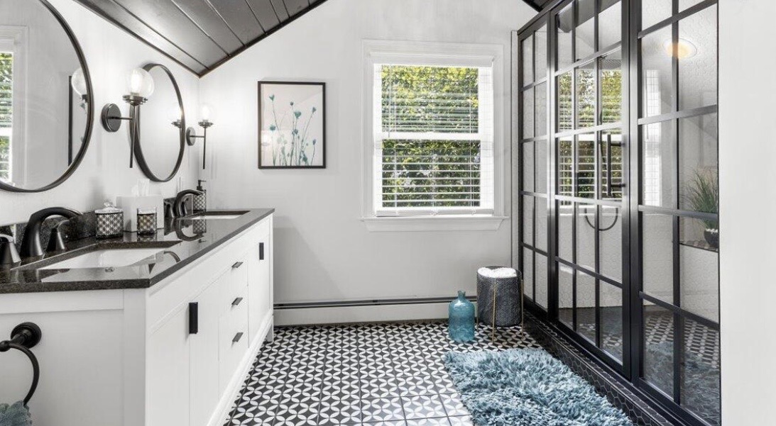 Black and white bathroom with glass-paneled shower