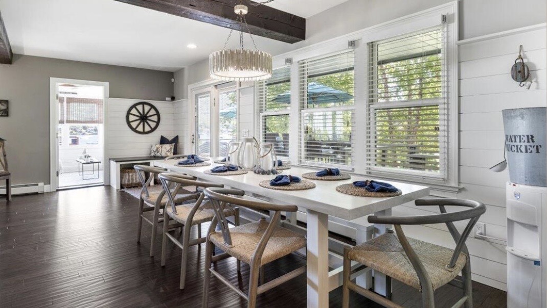 Waterfront dining room with shiplap and natural wood